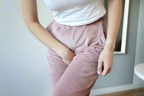 older woman running to the toilet because of urinary incontinence Mortlake
